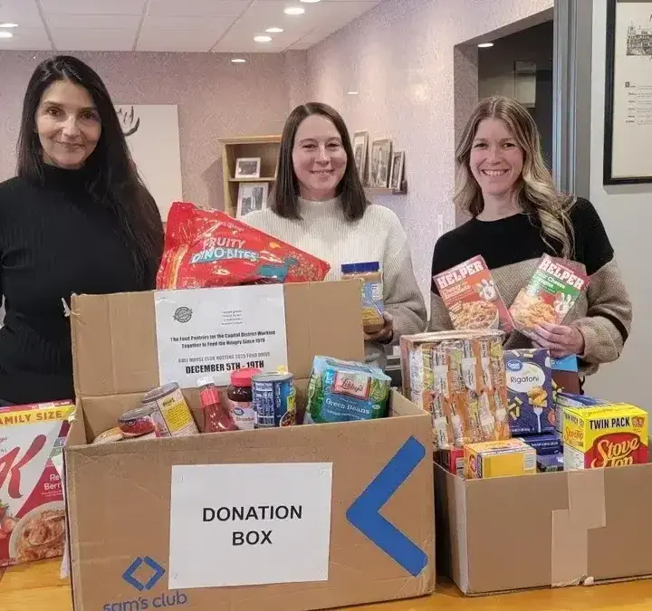 OpAD Media employees at OpAD Media Albany, New York office supporting an annual philanthropic community donation drive in the office at 150 State Street in Albany, NY to give back to the local community