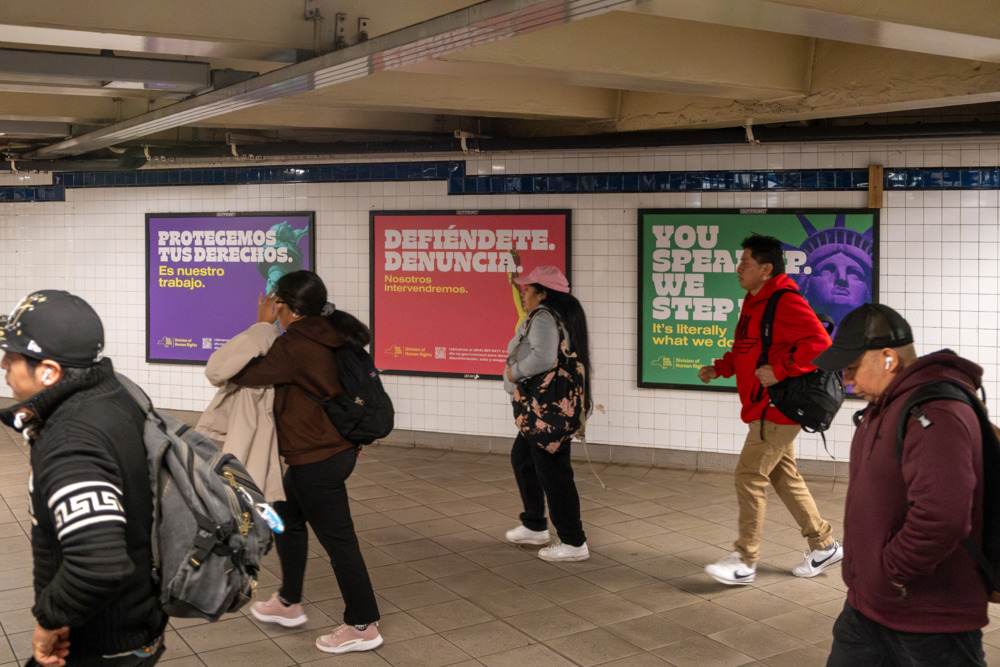 OpAD Media New York State Division of Human Rights out-of-home OOH transit advertising wall placement in New York City subway station — multicultural outdoor and transit media buying